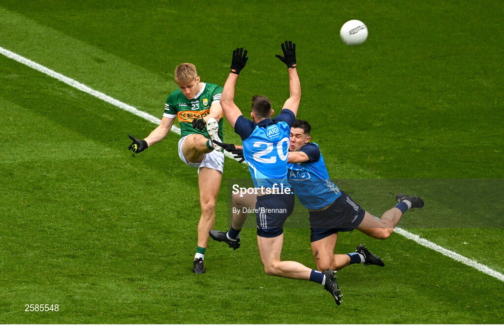 30 July 2023; Killian Spillane of Kerry scores a point despite the challenge of Seán MacMahon, left, and David Byrne during the GAA Football All-Ireland Senior Championship final match between Dublin and Kerry at Croke Park in Dublin. Photo by Daire Brennan/Sportsfile
