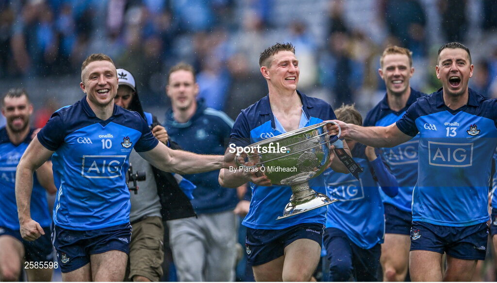30 July 2023; Dublin players Paddy Small, 10, John Small and Cormac Costello, 13, celebrate with the Sam Maguire Cup after their side's victory in the GAA Football All-Ireland Senior Championship final match between Dublin and Kerry at Croke Park in Dublin. Photo by Piaras Ó Mídheach/Sportsfile