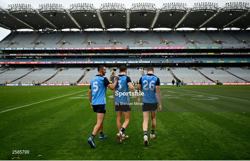 30 July 2023; Dublin players, from left, James McCarthy, Michael Fitzsimons and Dean Rock walk out to the middle of the pitch following the celebrations after their victory in the GAA Football All-Ireland Senior Championship final match between Dublin and Kerry at Croke Park in Dublin. Photo by Brendan Moran/Sportsfile