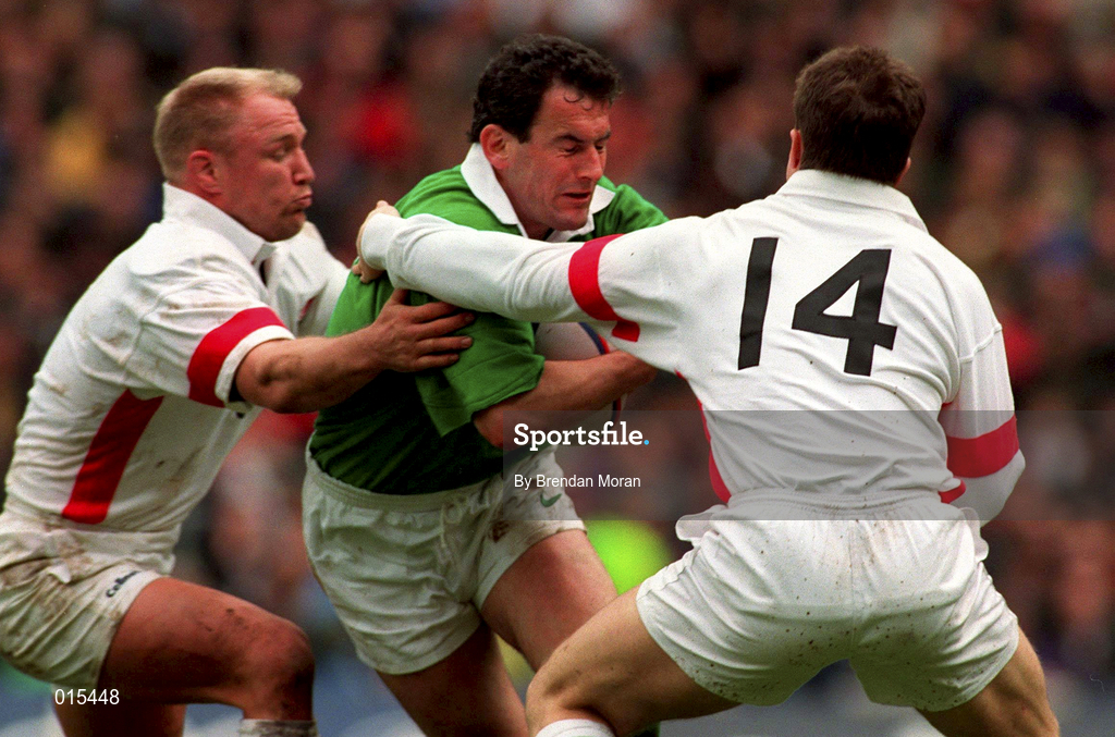 4 April 1998; Eric Elwood of Ireland is tackled by Neil Back, left, and Mike Catt of England during the Five Nations Rugby Championship match between England and Ireland at Twickenham Stadium in London, England. Photo by Brendan Moran/Sportsfile