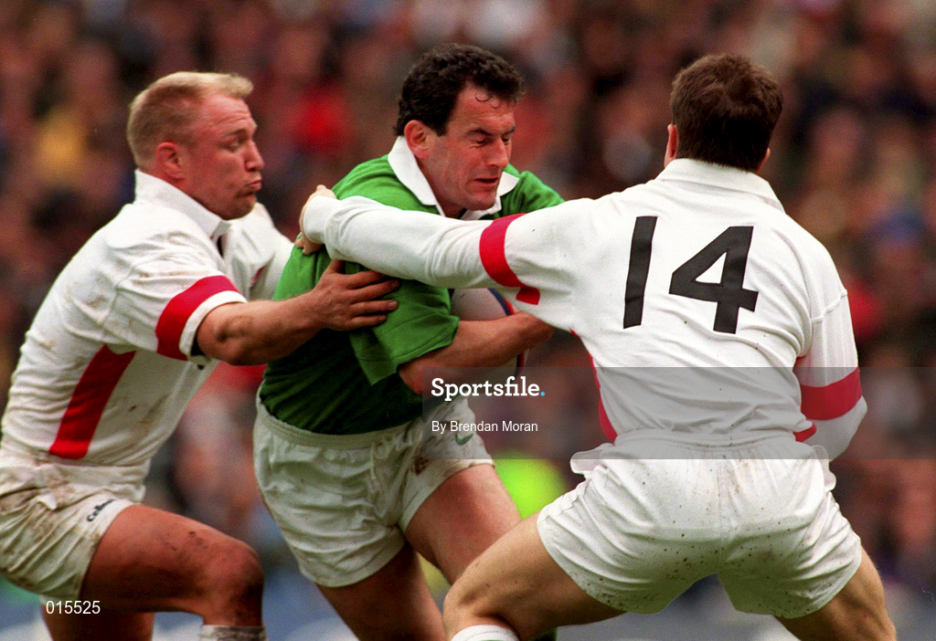 4 April 1998; Eric Elwood of Ireland is tackled by Neil Back, left, and Mike Catt of England during the Five Nations Rugby Championship match between England and Ireland at Twickenham Stadium in London, England. Photo by Brendan Moran/Sportsfile