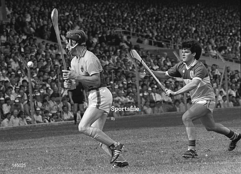 31 July 1984; Mick Jacob, Wexford, clears under pressure from Offaly's Paddy Corrigan. Leinster Senior hurling final, Offaly v Wexford, Cork Park, Dublin. Picture Credit; Ray McManus / SPORTSFILE