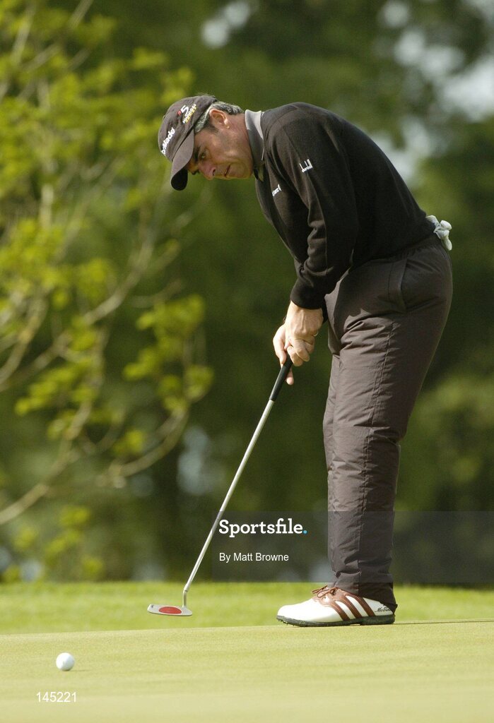 2 July 2004; Paul McGinley watches his putt on the 15th green during the Smurfit European Open. South Course, K Club, Straffan, Co. Kildare, Ireland. Picture credit; Matt Browne / SPORTSFILE
