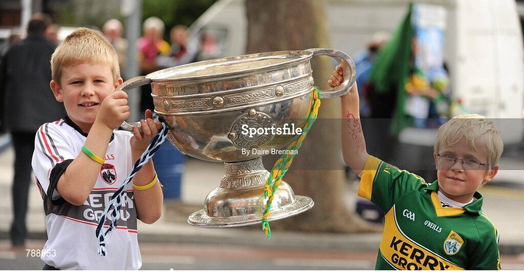 1 September 2013; Kerry supporters David O'Connor, right, aged 6, and his brother Darragh, aged 8, from Kenmare, Co. Kerry, hold the Sam Maguire cup. GAA Football All-Ireland Senior Championship, Semi-Final, Dublin v Kerry, Croke Park, Dublin. Picture credit: Dáire Brennan / SPORTSFILE
