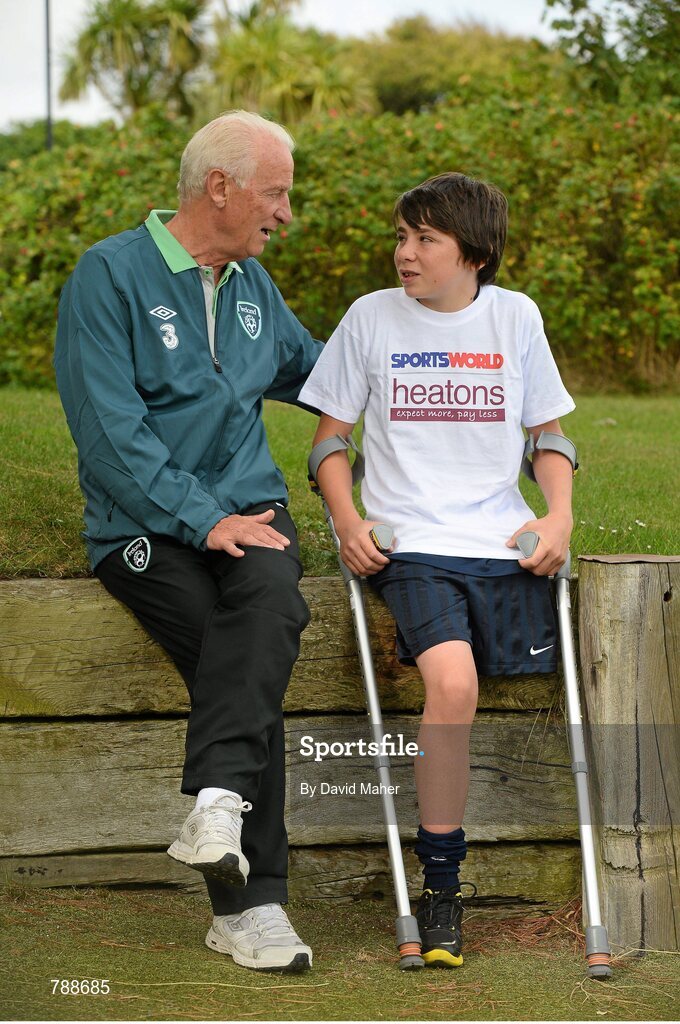 1 September 2013; Republic of Ireland manager Giovanni Trapattoni with 12 year old Neil Hoey, from Dublin, in attendance at the Heatons / Sportsworld ‘Football in the Community’ partnership launch. Portmarnock Hotel and Golf Links, Portmarnock, Co. Dublin. Picture credit: David Maher / SPORTSFILE