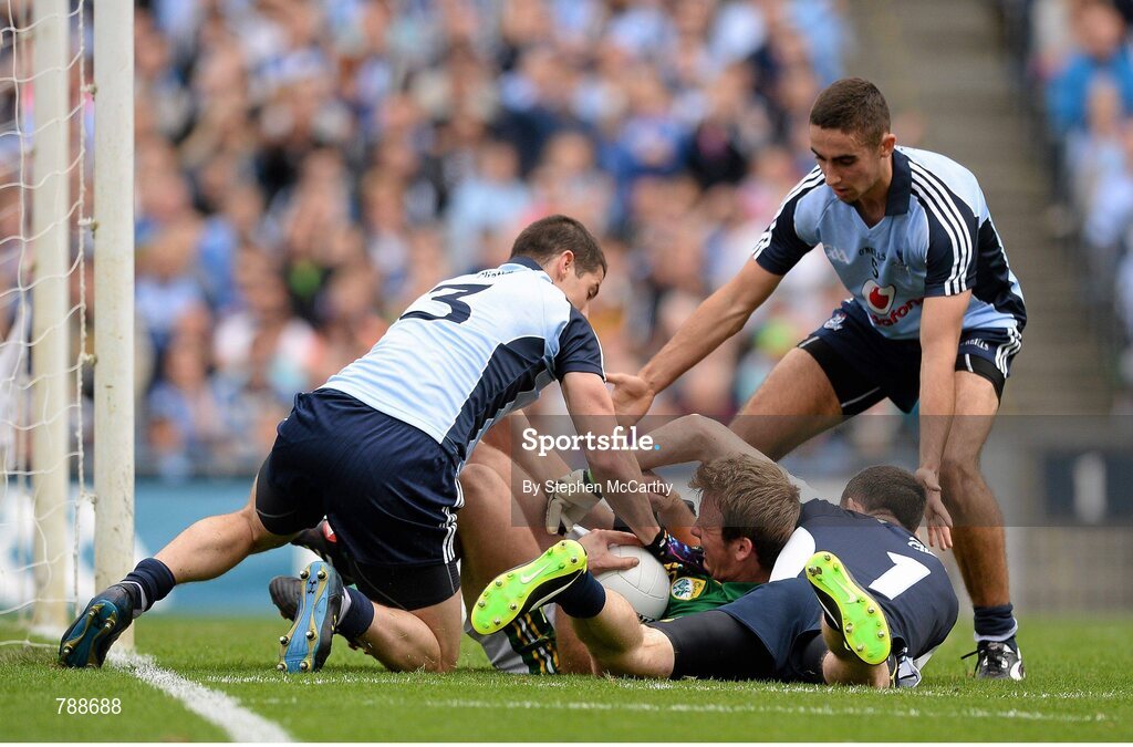 1 September 2013; Donnchadh Walsh, Kerry, is tackled by Dublin players, from left, Rory O'Carroll, Stephen Cluxton and James McCarthy resulting in a penalty to Kerry. GAA Football All-Ireland Senior Championship, Semi-Final, Dublin v Kerry, Croke Park, Dublin. Picture credit: Stephen McCarthy / SPORTSFILE