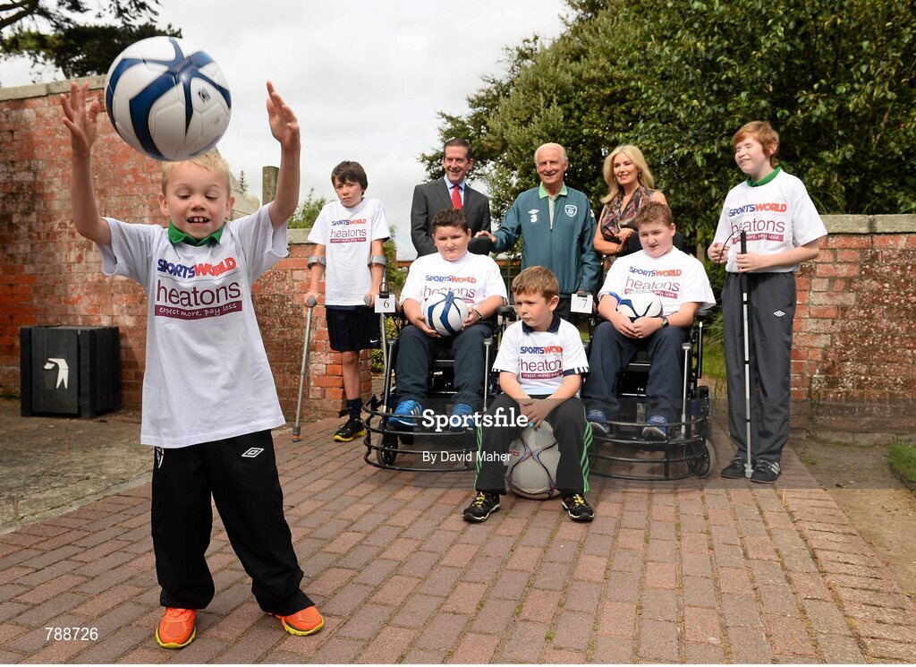 1 September 2013; Republic of Ireland manager Giovanni Trapattoni with David Myers and Jackie Kelly from Heatons / Sportsworld, with children, left to right, James Cosserly, age 7, from Dublin, Neil Hoey, age 12, from Dublin, Sean Donogher, from Kinnity, Co.Offaly, Conor Roode, age 7, from Dublin, Thomas Donogher, from Kinnity, Co.Offaly, and Josh Kelly, age 11, from Dublin,  in attendance at the Heatons / Sportsworld ‘Football in the Community’ partnership launch. Portmarnock Hotel and Golf Links, Portmarnock, Co. Dublin. Picture credit: David Maher / SPORTSFILE