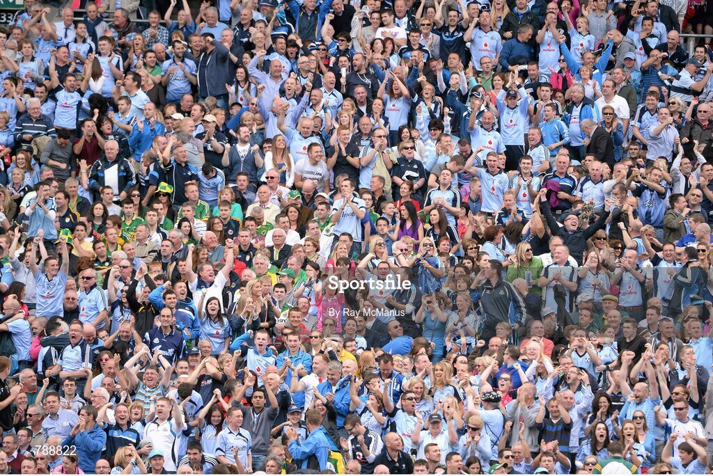 1 September 2013; Supporters in the Hogan Stand celebrate a point scored by Dublin's Diarmuid Connolly, which put Dublin ahead by four points late in the game. GAA Football All-Ireland Senior Championship, Semi-Final, Dublin v Kerry, Croke Park, Dublin. Picture credit: Ray McManus / SPORTSFILE