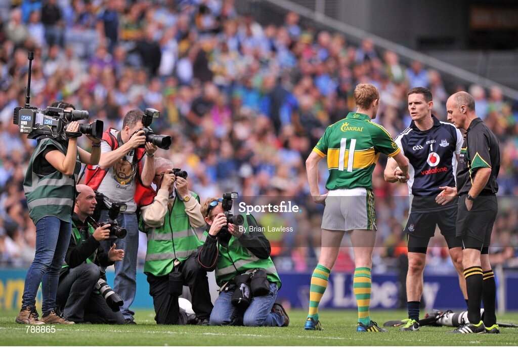 1 September 2013; Dublin captain Stephen Cluxton and Kerry captain Colm Cooper shake hands in the company of referee Cormac Reilly before the match. GAA Football All-Ireland Senior Championship, Semi-Final, Dublin v Kerry, Croke Park, Dublin. Picture credit: Brian Lawless / SPORTSFILE