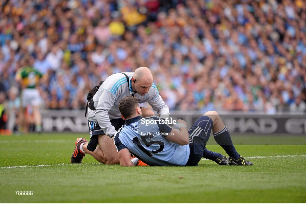 1 September 2013; Bernard Brogan is attended to by Dublin Phisio Kieran O'Reilly.  GAA Football All-Ireland Senior Championship, Semi-Final, Dublin v Kerry, Croke Park, Dublin. Picture credit: Ray McManus / SPORTSFILE