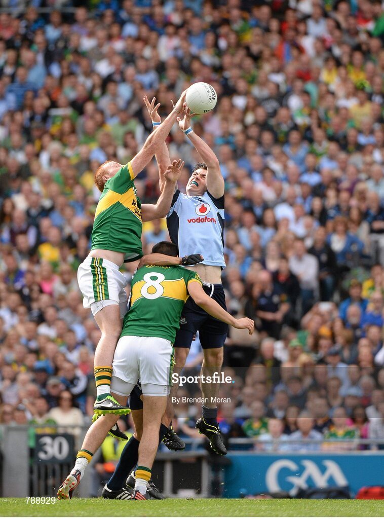 1 September 2013; Johnny Buckley and Anthony Maher, Kerry, contest a kick out with Michael Darragh MacAuley, Dublin. GAA Football All-Ireland Senior Championship, Semi-Final, Dublin v Kerry, Croke Park, Dublin. Picture credit: Brendan Moran / SPORTSFILE