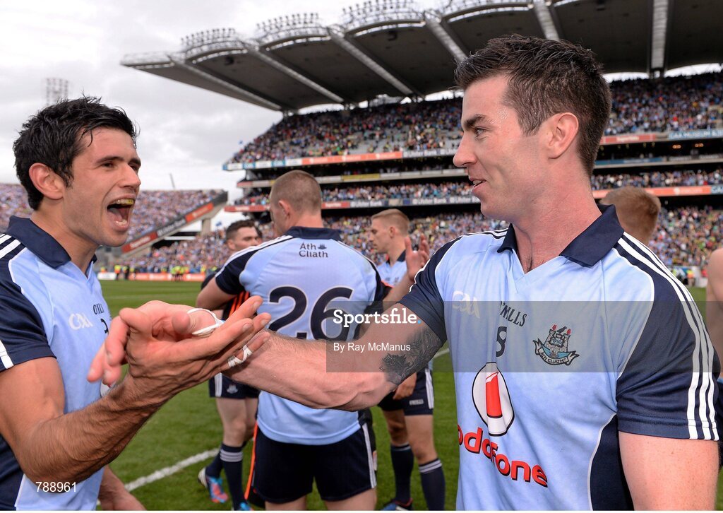 1 September 2013; Dublin players Cian O'Sullivan, left, and Michael Darragh MacAuley celebrate after the game. GAA Football All-Ireland Senior Championship, Semi-Final, Dublin v Kerry, Croke Park, Dublin. Picture credit: Ray McManus / SPORTSFILE