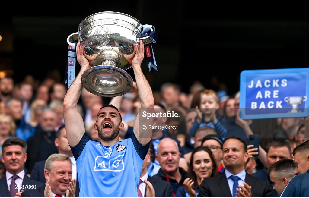 30 July 2023; Seán MacMahon of Dublin lifts the Sam Maguire Cup after the GAA Football All-Ireland Senior Championship final match between Dublin and Kerry at Croke Park in Dublin. Photo by Ramsey Cardy/Sportsfile