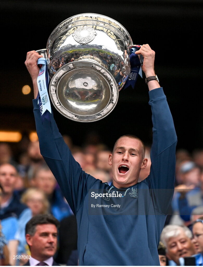 30 July 2023; Peadar Ó Cofaigh Byrne of Dublin lifts the Sam Maguire Cup after the GAA Football All-Ireland Senior Championship final match between Dublin and Kerry at Croke Park in Dublin. Photo by Ramsey Cardy/Sportsfile