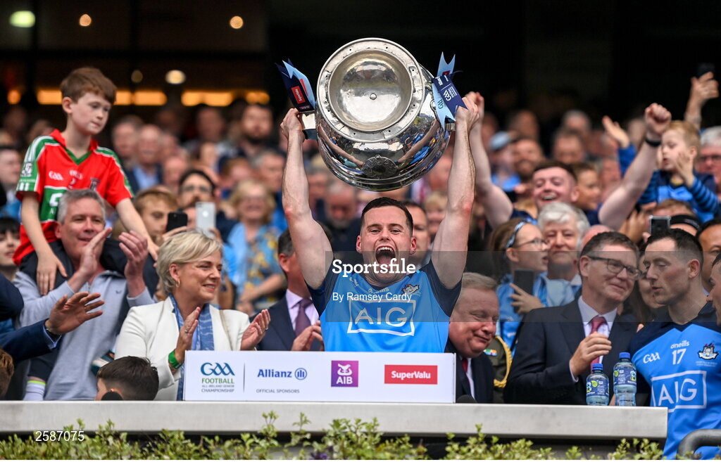 30 July 2023; Ross McGarry of Dublin lifts the Sam Maguire Cup after the GAA Football All-Ireland Senior Championship final match between Dublin and Kerry at Croke Park in Dublin. Photo by Ramsey Cardy/Sportsfile
