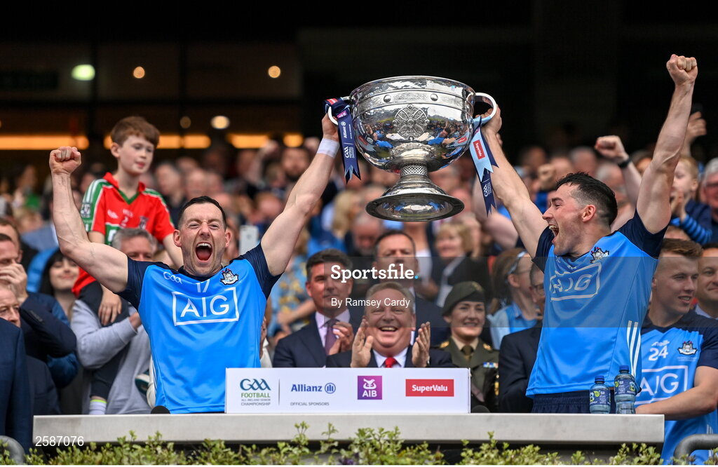 30 July 2023; Dublin players Ryan Basquel, left, and Colm Basquel lift the Sam Maguire Cup after their side's victory in the GAA Football All-Ireland Senior Championship final match between Dublin and Kerry at Croke Park in Dublin. Photo by Ramsey Cardy/Sportsfile