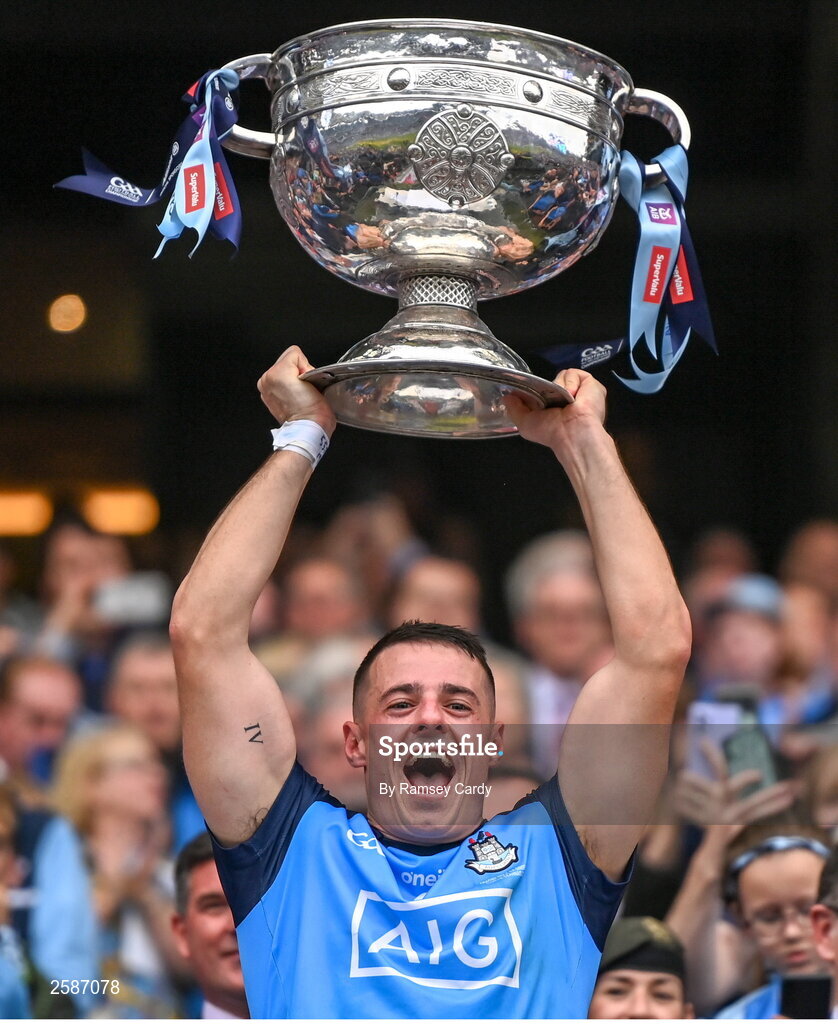 30 July 2023; Brian Howard of Dublin lifts the Sam Maguire Cup after the GAA Football All-Ireland Senior Championship final match between Dublin and Kerry at Croke Park in Dublin. Photo by Ramsey Cardy/Sportsfile
