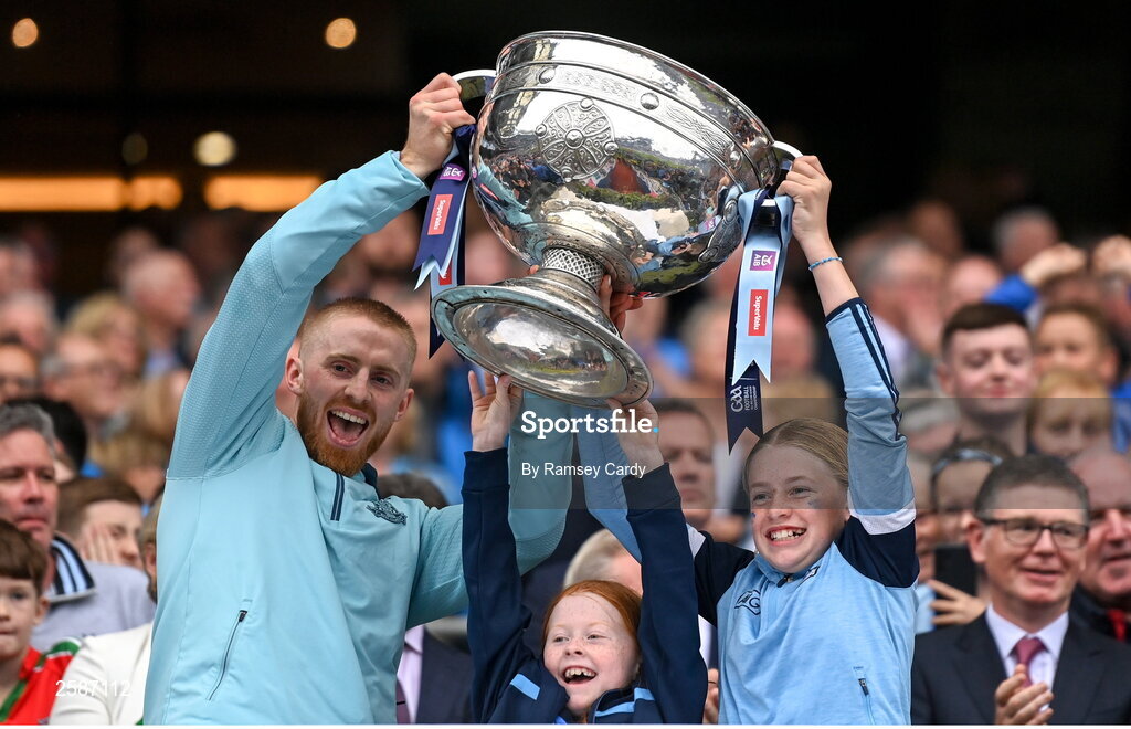 30 July 2023; Killian O'Gara of Dublin lifts the Sam Maguire Cup after the GAA Football All-Ireland Senior Championship final match between Dublin and Kerry at Croke Park in Dublin. Photo by Ramsey Cardy/Sportsfile