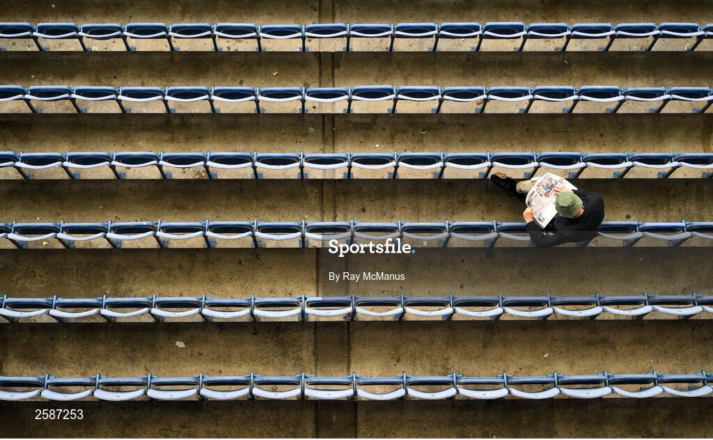 30 July 2023; A early arriving supporter, seated in the Hogan Stand, reads his newspaper before the GAA Football All-Ireland Senior Championship final match between Dublin and Kerry at Croke Park in Dublin. Photo by Ray McManus/Sportsfile