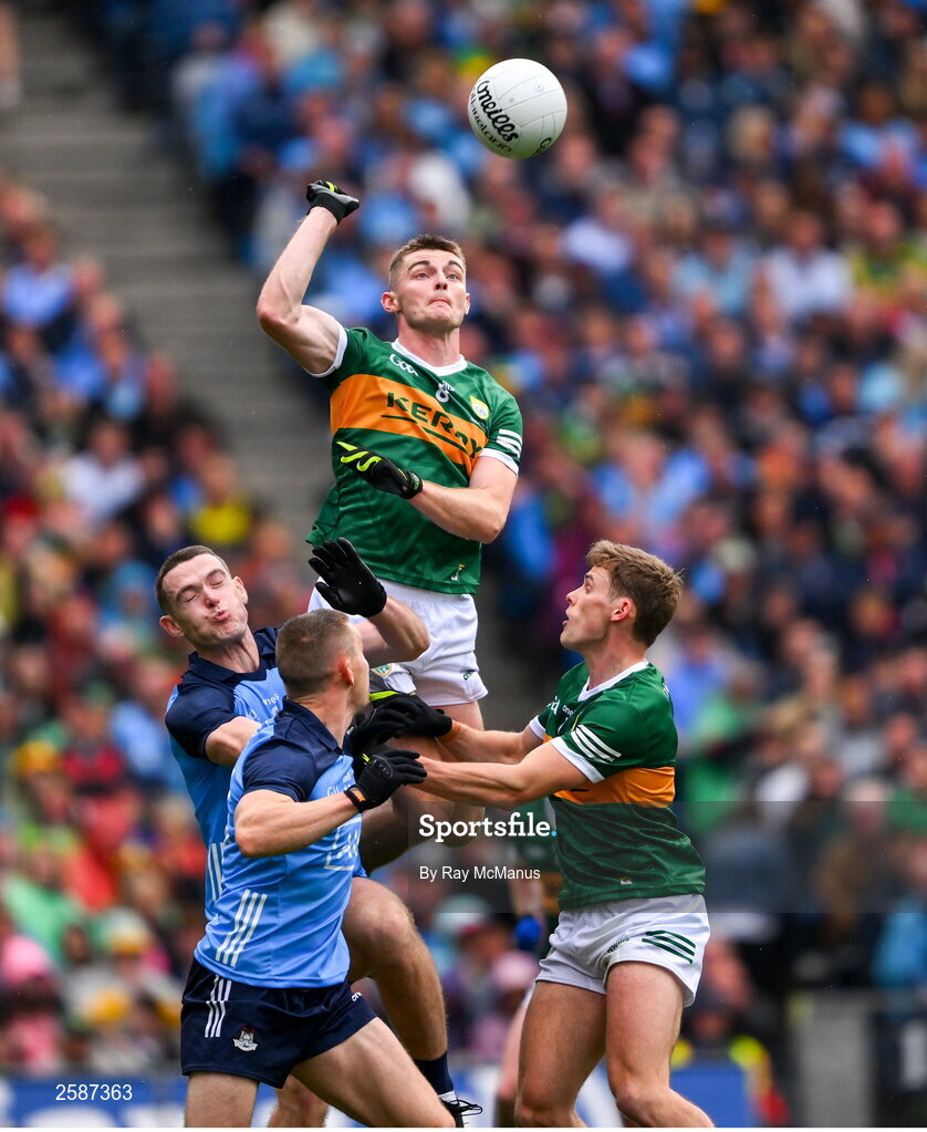 30 July 2023; Diarmuid O'Connor of Kerry supported by Gavin White punches the ball clear of Dublin pair Brian Fenton and Con O'Callaghan during the GAA Football All-Ireland Senior Championship final match between Dublin and Kerry at Croke Park in Dublin. Photo by Ray McManus/Sportsfile