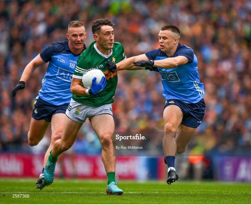 30 July 2023; Paudie Clifford of Kerry is tackled by Eoin Murchan supported by Ciaran Kilkenny during the GAA Football All-Ireland Senior Championship final match between Dublin and Kerry at Croke Park in Dublin. Photo by Ray McManus/Sportsfile