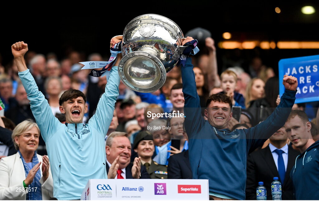 30 July 2023; Dublin players Ben Millist, left, and Liam Smith lift the Sam Maguire Cup after the GAA Football All-Ireland Senior Championship final match between Dublin and Kerry at Croke Park in Dublin. Photo by Seb Daly/Sportsfile