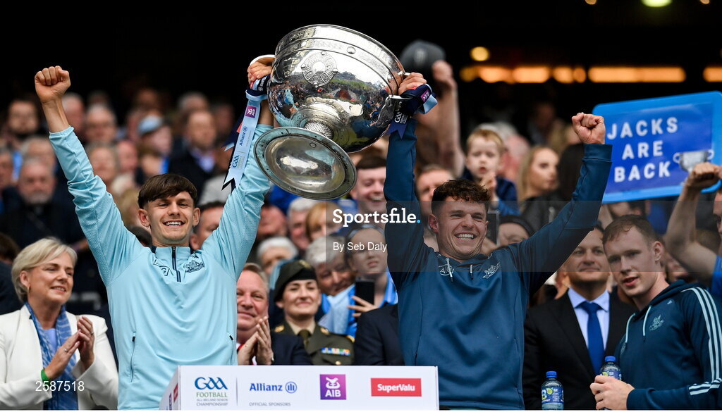 30 July 2023; Dublin players Ben Millist, left, and Liam Smith lift the Sam Maguire Cup after the GAA Football All-Ireland Senior Championship final match between Dublin and Kerry at Croke Park in Dublin. Photo by Seb Daly/Sportsfile