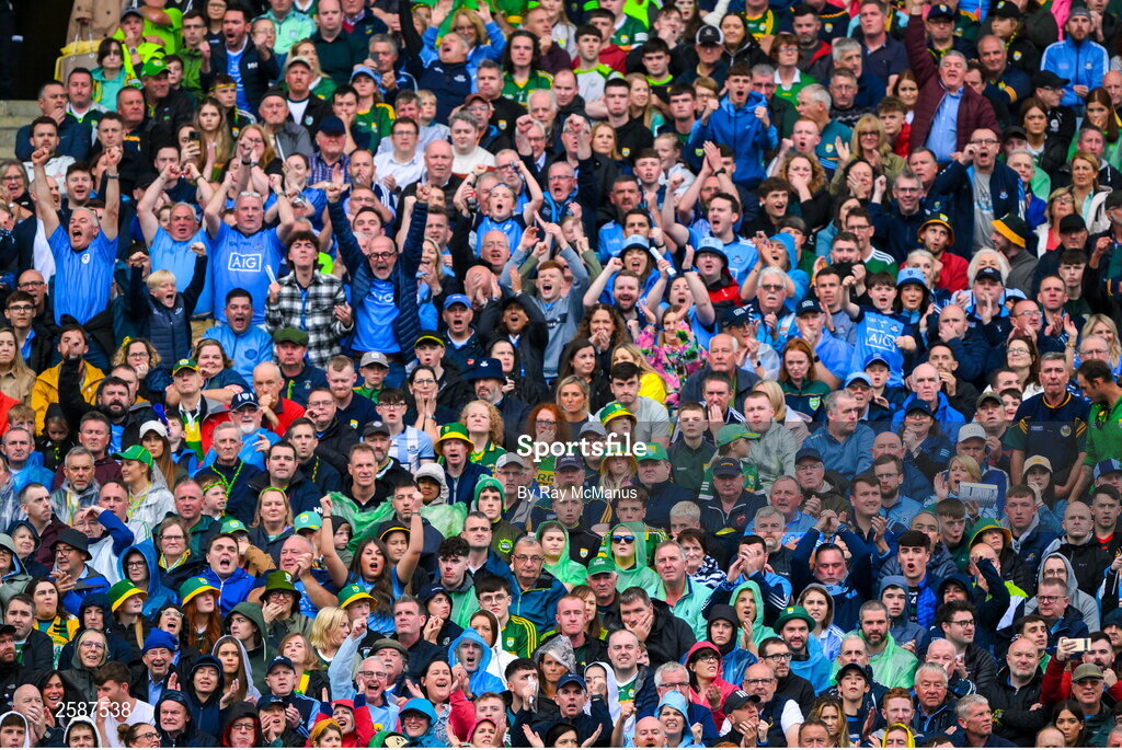 30 July 2023; Dublin supporters, in the Hogan Stand, celebrate a score during the GAA Football All-Ireland Senior Championship final match between Dublin and Kerry at Croke Park in Dublin. Photo by Ray McManus/Sportsfile
