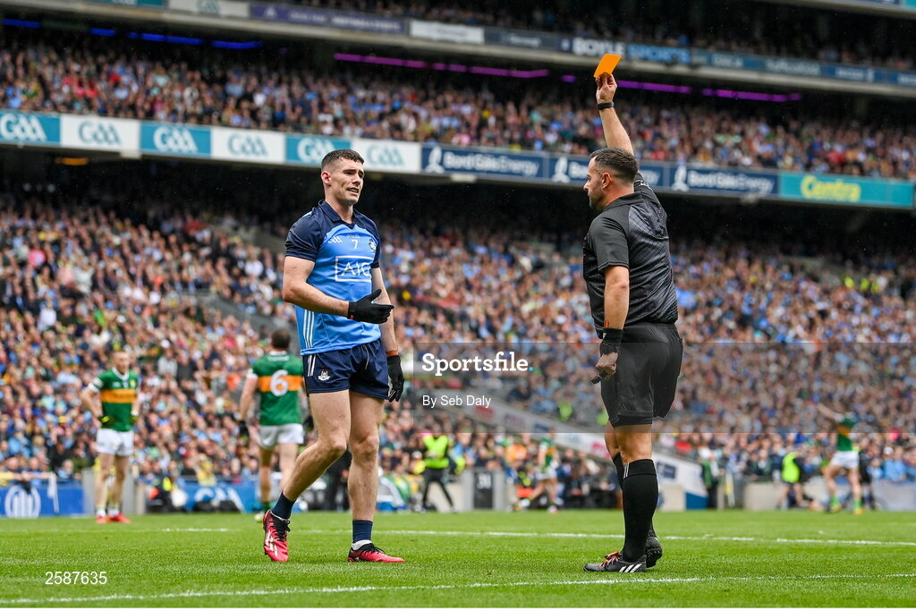 30 July 2023; Referee David Gough shows a yellow card to Lee Gannon of Dublin  during the GAA Football All-Ireland Senior Championship final match between Dublin and Kerry at Croke Park in Dublin. Photo by Seb Daly/Sportsfile