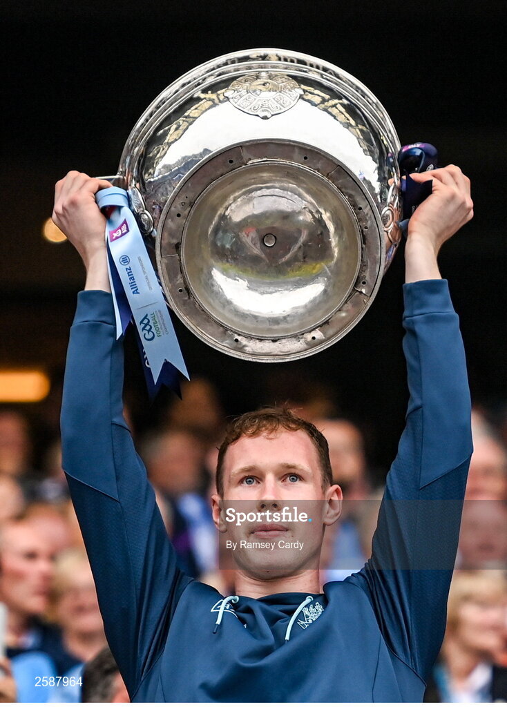30 July 2023; Senan Forker of Dublin lifts the Sam Maguire Cup after the GAA Football All-Ireland Senior Championship final match between Dublin and Kerry at Croke Park in Dublin. Photo by Ramsey Cardy/Sportsfile