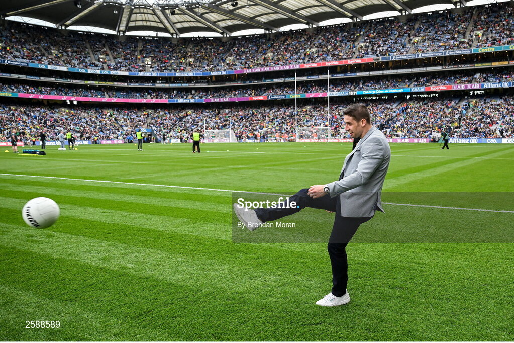 30 July 2023; Former Mayo footballer and RTE analyst Lee Keegan returns a football during the team warmups before the GAA Football All-Ireland Senior Championship final match between Dublin and Kerry at Croke Park in Dublin. Photo by Brendan Moran/Sportsfile