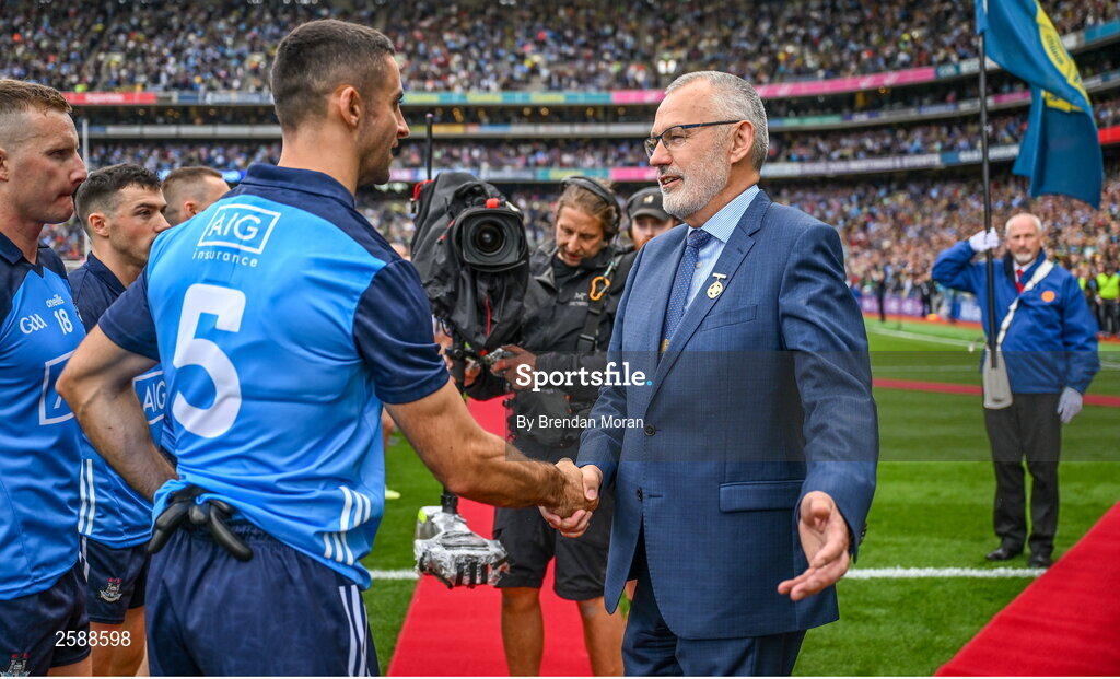 30 July 2023; Uachtarán Chumann Lúthchleas Gael Larry McCarthy is greeted by Dublin captain James McCarthy before the GAA Football All-Ireland Senior Championship final match between Dublin and Kerry at Croke Park in Dublin. Photo by Brendan Moran/Sportsfile