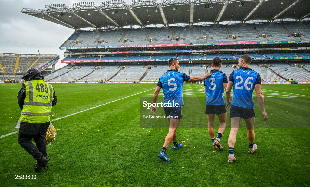 30 July 2023; Dublin players, from left, James McCarthy, Michael Fitzsimons and Dean Rock walk out to the middle of the pitch following the celebrations of their victory in the GAA Football All-Ireland Senior Championship final match between Dublin and Kerry at Croke Park in Dublin. Photo by Brendan Moran/Sportsfile