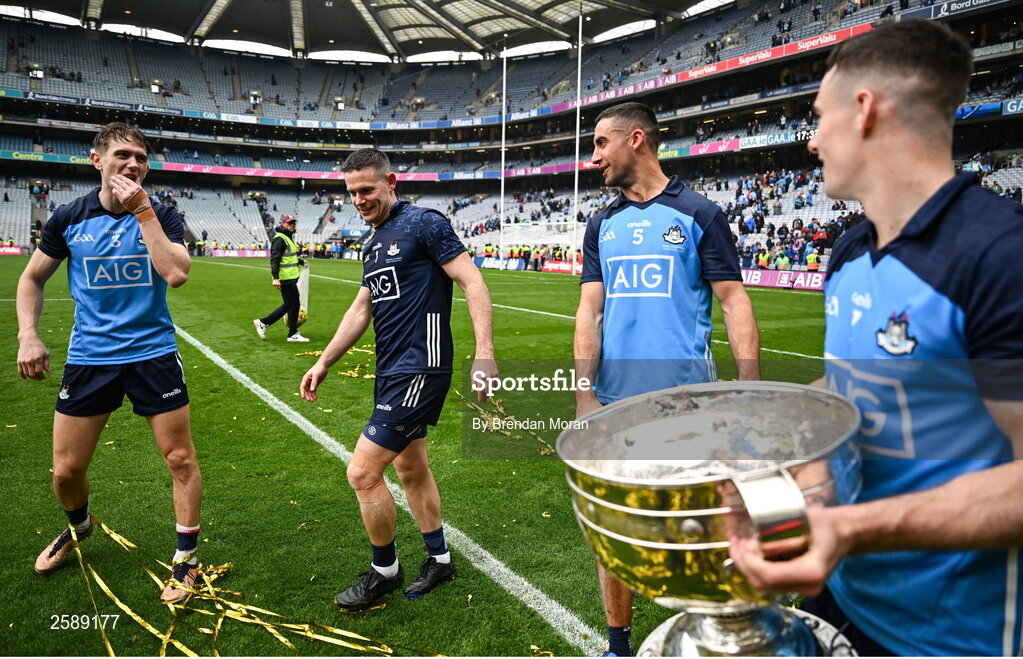 30 July 2023; Dublin nine time All-Ireland medal winners, from left, Michael Fitzsimons, Stephen Cluxton and James McCarthy with teammate Lee Gannon and the Sam Maguire Cup after the GAA Football All-Ireland Senior Championship final match between Dublin and Kerry at Croke Park in Dublin. Photo by Brendan Moran/Sportsfile