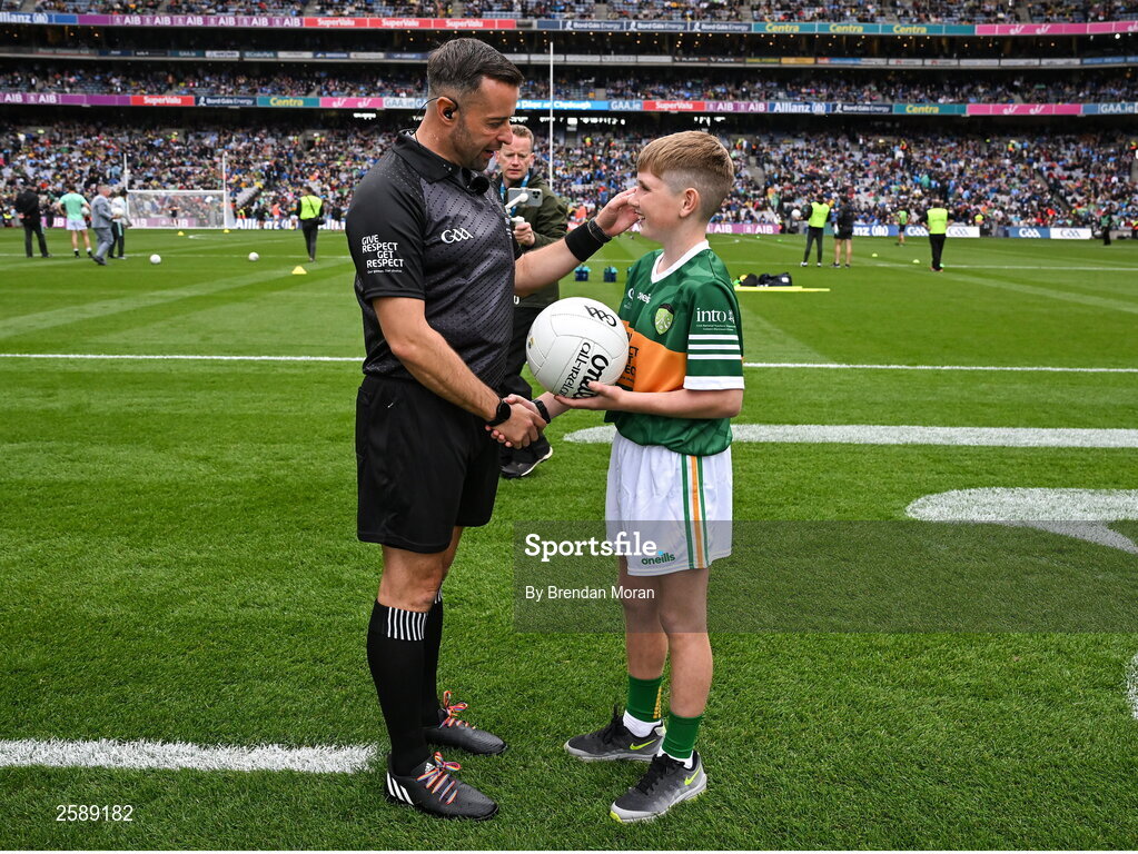 30 July 2023; Joseph Field from Listellick National School in Tralee, Kerry, presents the match ball to referee David Gough before the GAA Football All-Ireland Senior Championship final match between Dublin and Kerry at Croke Park in Dublin. Photo by Brendan Moran/Sportsfile