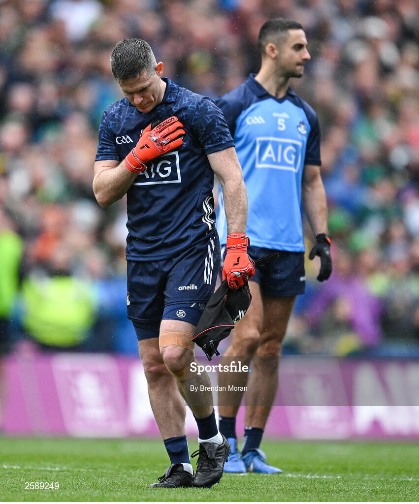 30 July 2023; Dublin goalkeeper Stephen Cluxton touches the crest on his jersey as he makes hsi way to his goals before the GAA Football All-Ireland Senior Championship final match between Dublin and Kerry at Croke Park in Dublin. Photo by Brendan Moran/Sportsfile