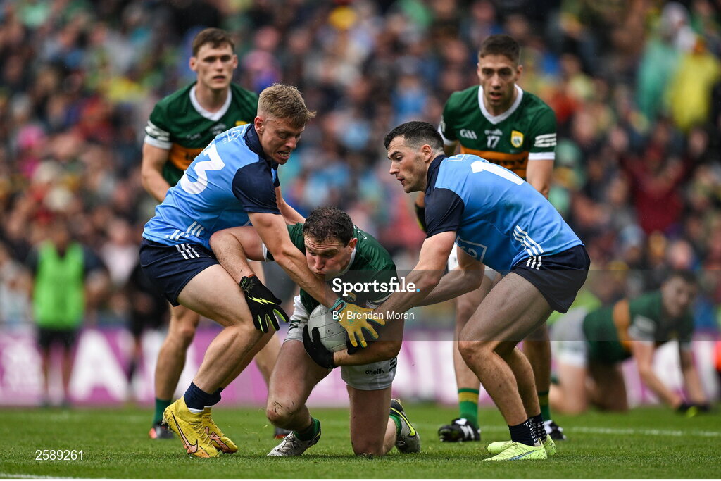 30 July 2023; Tadhg Morley of Kerry is tackled by Cian Murphy, left, and Colm Basquel of Dublin during the GAA Football All-Ireland Senior Championship final match between Dublin and Kerry at Croke Park in Dublin. Photo by Brendan Moran/Sportsfile