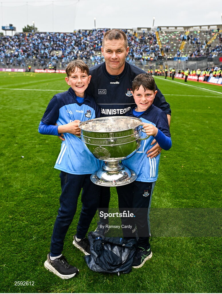 30 July 2023; Dublin manager Dessie Farrell with Luke O’Regan, left, and Oisìn O’Regan, right, and the Sam Maguire Cup after the GAA Football All-Ireland Senior Championship final match between Dublin and Kerry at Croke Park in Dublin. Photo by Ramsey Cardy/Sportsfile