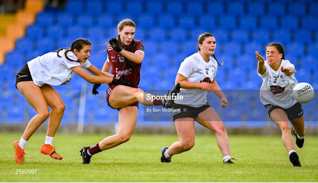 5 August 2023; Aisling Madden of Galway scores her side's first goal despite Kildare players, from left, Julie Brannigan, Zara Hurley and Joy Duggan during the ZuCar All-Ireland Ladies Football U18 A final match between Galway and Kildare at Glennon Brothers Pearse Park in Longford. Photo by Ben McShane/Sportsfile