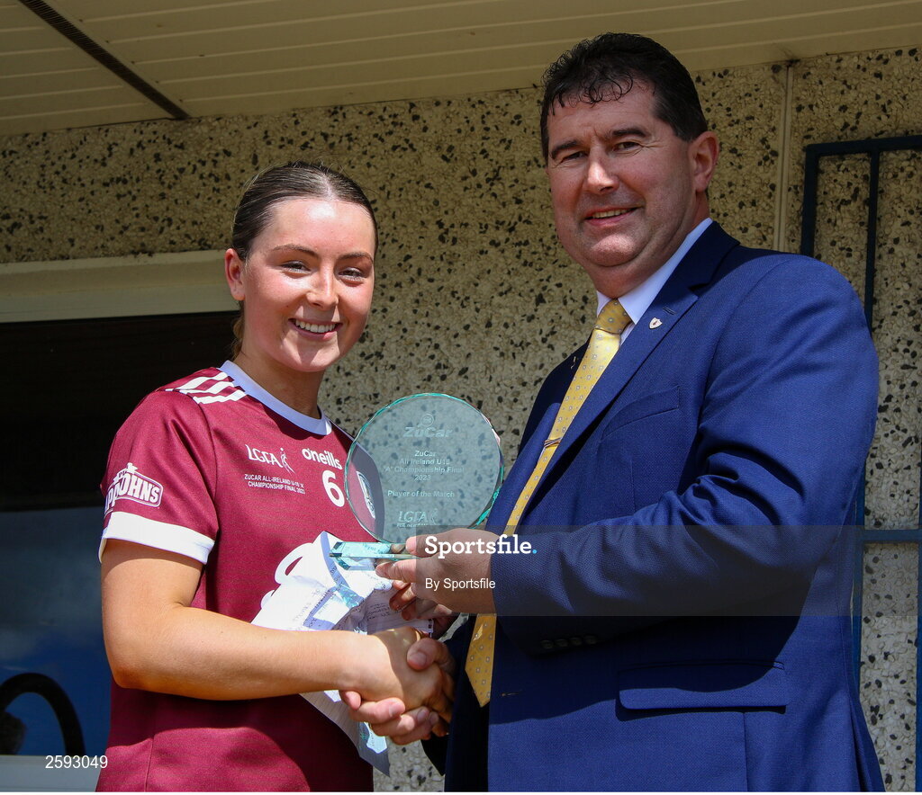 5 August 2023; Aoibhinn Eilian of Galway is presented with the ZuCar Player of the Match by Uachtarán Cumann Peil Gael na mBan, Mícheál Naughton after the ZuCar All-Ireland Ladies Football U18 A final match between Galway and Kildare at Glennon Brothers Pearse Park in Longford. Photo by Sportsfile