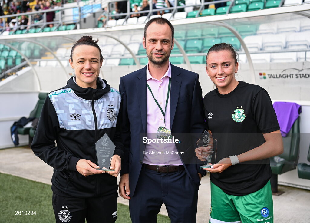 26 August 2023; Shamrock Rovers chief executive officer John Martin makes a presentation to Aine O'Gorman, left, and Abbie Larkin before the Sports Direct Women’s FAI Cup first round match between Shamrock Rovers and Killester Donnycarney at Tallaght Stadium in Dublin. Photo by Stephen McCarthy/Sportsfile