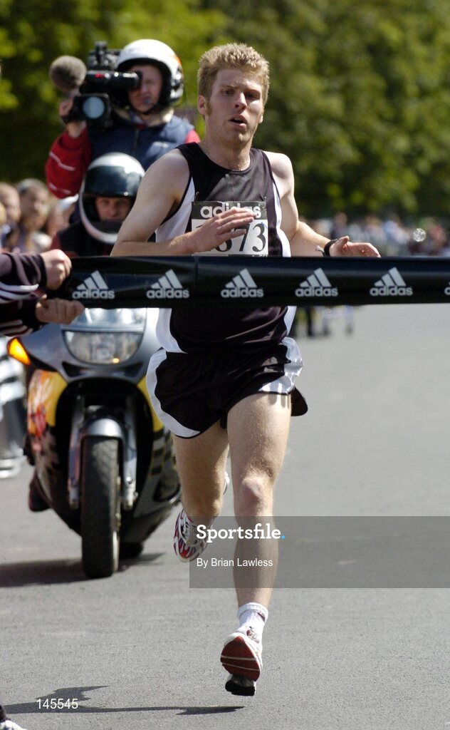 4 July 2004; Thomas Carey crosses the finish line to win the adidas Irish Runner Challenge, in a time of 24:22, Phoenix Park, Dublin. Picture credit; Brian Lawless / SPORTSFILE