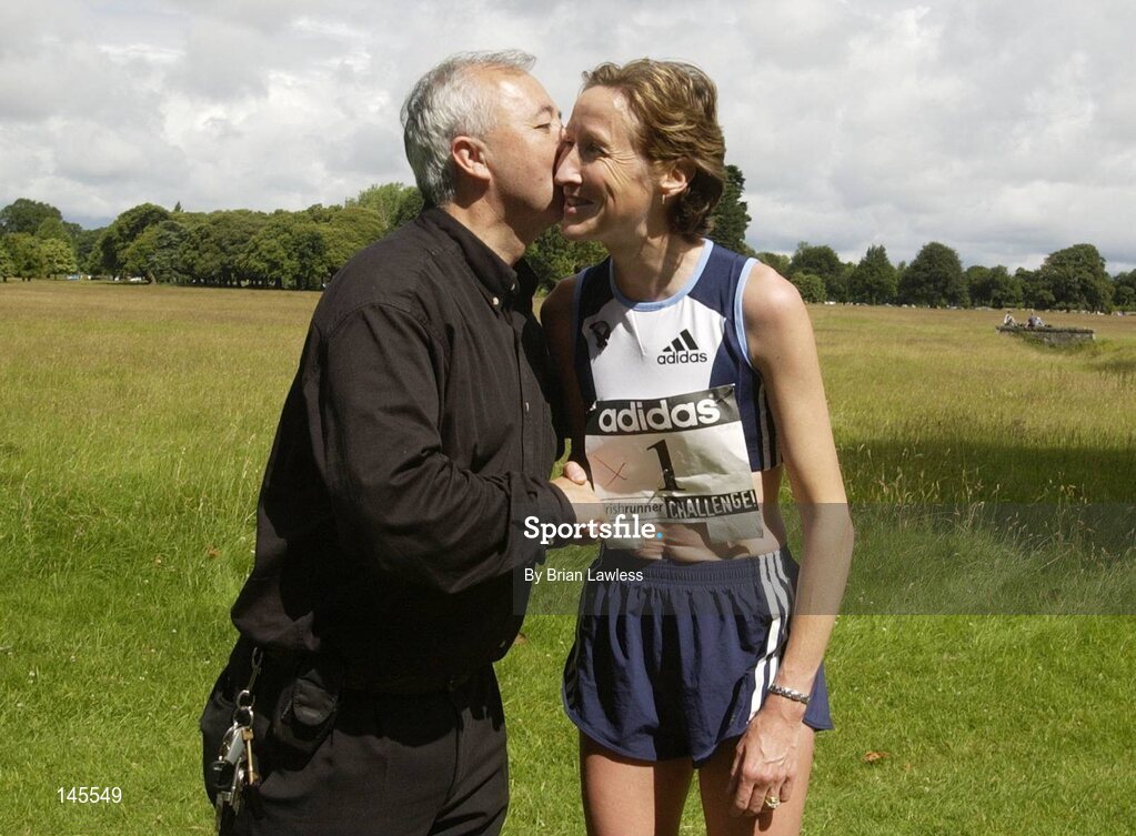 4 July 2004; Irish Runner Editor Frank Greally congratulates Catherina McKiernan, who was the first woman home, after the adidas Irish Runner Challenge, Phoenix Park, Dublin. Picture credit; Brian Lawless / SPORTSFILE