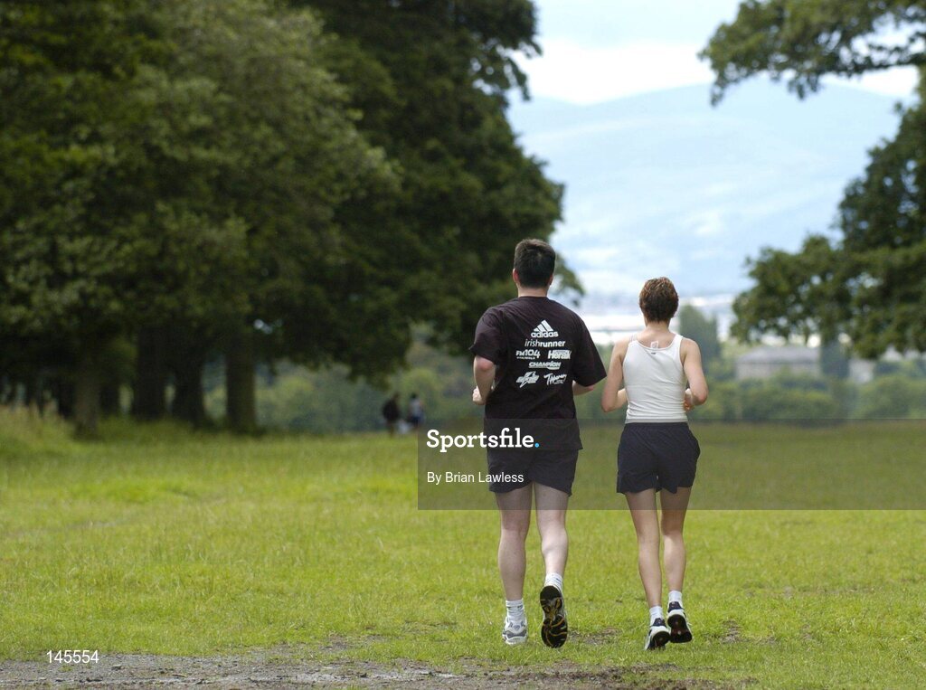 4 July 2004; Participants in the adidas Irish Runner Challenge make their way out of the Phoenix Park after the race, Dublin. Picture credit; Brian Lawless / SPORTSFILE