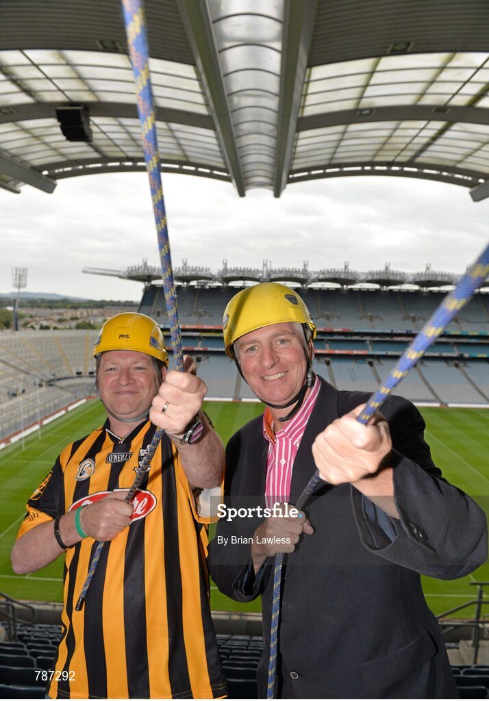 28 August 2013; The Sunday Game Presenter Michael Lyster was joined today in Croke Park by motor neurone disease (MND) sufferer Paul Lannon and friends sporting their county colours to encourage others from across Ireland to abseil 100ft off the Hogan Stand in aid of the Irish Motor Neurone Disease Association (IMNDA). At the event is Michael Lyster with Paul Lannon, from Knocktopher, Co. Kilkenny, left. Croke Park, Dublin. Picture credit: Brian Lawless / SPORTSFILE