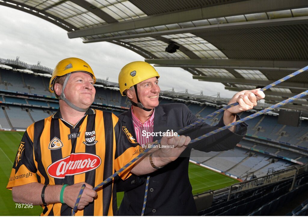 28 August 2013; The Sunday Game Presenter Michael Lyster was joined today in Croke Park by motor neurone disease (MND) sufferer Paul Lannon and friends sporting their county colours to encourage others from across Ireland to abseil 100ft off the Hogan Stand in aid of the Irish Motor Neurone Disease Association (IMNDA). At the event is Michael Lyster with Paul Lannon, from Knocktopher, Co. Kilkenny, left. Croke Park, Dublin. Picture credit: Brian Lawless / SPORTSFILE