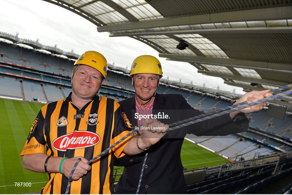 28 August 2013; The Sunday Game Presenter Michael Lyster was joined today in Croke Park by motor neurone disease (MND) sufferer Paul Lannon and friends sporting their county colours to encourage others from across Ireland to abseil 100ft off the Hogan Stand in aid of the Irish Motor Neurone Disease Association (IMNDA). At the event is Michael Lyster with Paul Lannon, from Knocktopher, Co. Kilkenny, left. Croke Park, Dublin. Picture credit: Brian Lawless / SPORTSFILE