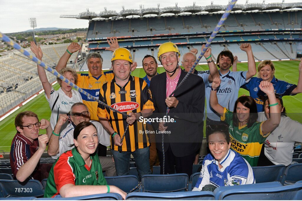 28 August 2013; The Sunday Game Presenter Michael Lyster was joined today in Croke Park by motor neurone disease (MND) sufferer Paul Lannon and friends sporting their county colours to encourage others from across Ireland to abseil 100ft off the Hogan Stand in aid of the Irish Motor Neurone Disease Association (IMNDA). At the event is Michael Lyster, Paul Lannon, from Knocktopher, Co. Kilkenny, and GAA supporters. Croke Park, Dublin. Picture credit: Brian Lawless / SPORTSFILE