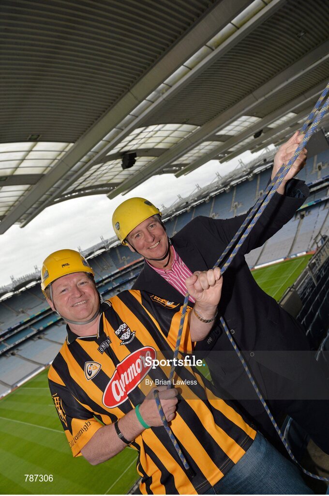 28 August 2013; The Sunday Game Presenter Michael Lyster was joined today in Croke Park by motor neurone disease (MND) sufferer Paul Lannon and friends sporting their county colours to encourage others from across Ireland to abseil 100ft off the Hogan Stand in aid of the Irish Motor Neurone Disease Association (IMNDA). At the event is Michael Lyster with Paul Lannon, from Knocktopher, Co. Kilkenny, left. Croke Park, Dublin. Picture credit: Brian Lawless / SPORTSFILE