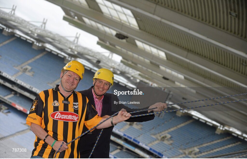 28 August 2013; The Sunday Game Presenter Michael Lyster was joined today in Croke Park by motor neurone disease (MND) sufferer Paul Lannon and friends sporting their county colours to encourage others from across Ireland to abseil 100ft off the Hogan Stand in aid of the Irish Motor Neurone Disease Association (IMNDA). At the event is Michael Lyster with Paul Lannon, from Knocktopher, Co. Kilkenny, left. Croke Park, Dublin. Picture credit: Brian Lawless / SPORTSFILE